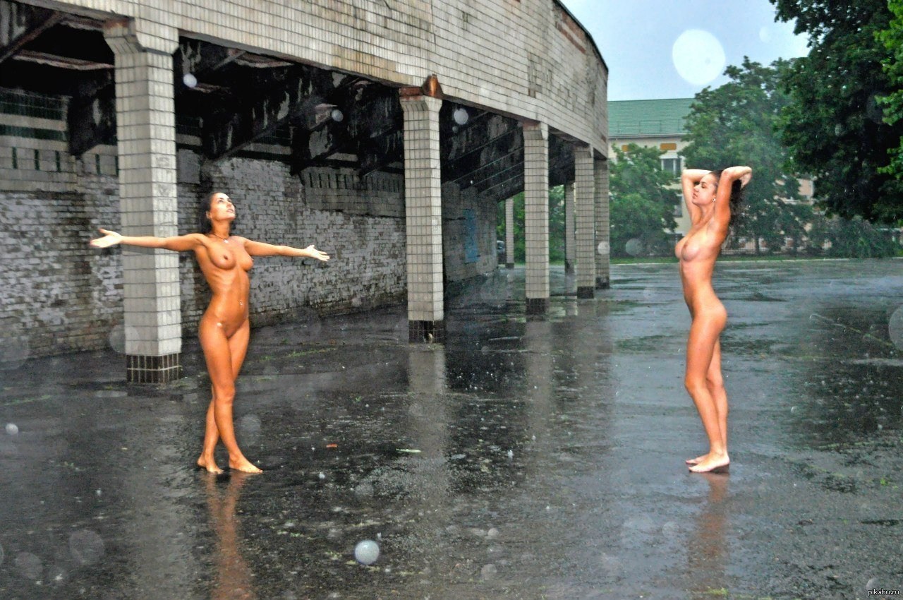 Nude women in the rain.